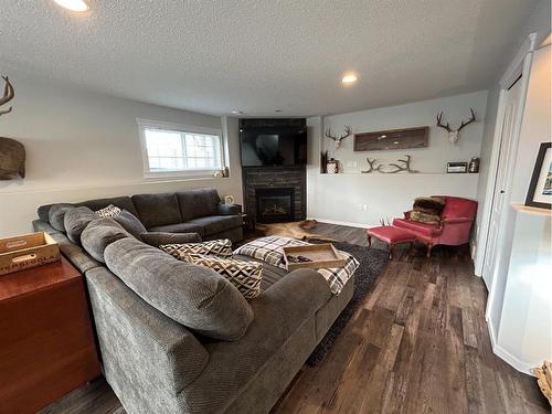 637 East 1 Street, Dunmore, AB - Indoor Photo Showing Living Room With Fireplace