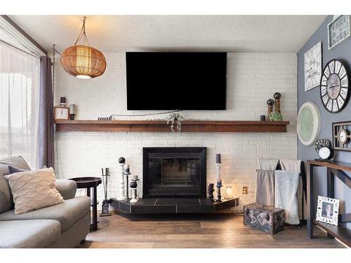 75 Greenbrook Crescent, Brooks, AB - Indoor Photo Showing Living Room With Fireplace