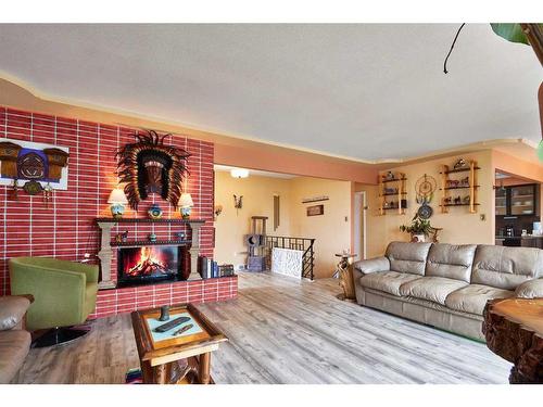 102 3 Street Sw, Medicine Hat, AB - Indoor Photo Showing Living Room With Fireplace