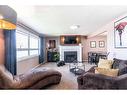 73 Markwick Drive Se, Medicine Hat, AB  - Indoor Photo Showing Living Room With Fireplace 