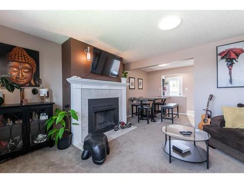 73 Markwick Drive Se, Medicine Hat, AB - Indoor Photo Showing Living Room With Fireplace