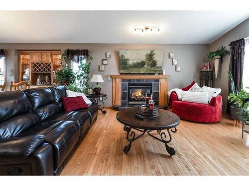 306 2 Avenue East, Oyen, AB - Indoor Photo Showing Living Room With Fireplace