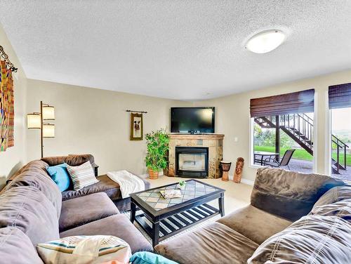 10 Chinook Court Sw, Medicine Hat, AB - Indoor Photo Showing Living Room With Fireplace