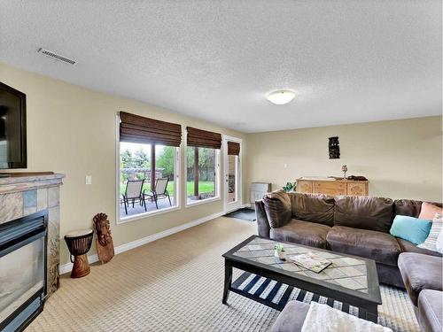 10 Chinook Court Sw, Medicine Hat, AB - Indoor Photo Showing Living Room With Fireplace