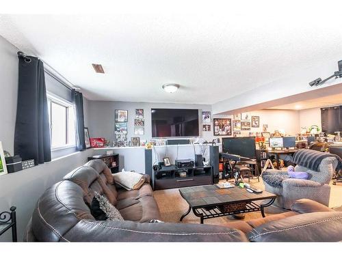 228 Seven Persons Drive Sw, Medicine Hat, AB - Indoor Photo Showing Living Room With Fireplace
