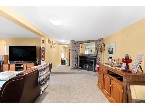 428 6 Street, Suffield, AB - Indoor Photo Showing Living Room With Fireplace