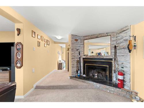 428 6 Street, Suffield, AB - Indoor Photo Showing Living Room With Fireplace