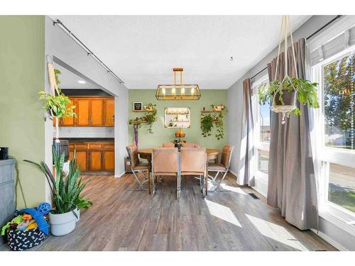 41 Rundle Crescent Se, Medicine Hat, AB - Indoor Photo Showing Dining Room With Fireplace