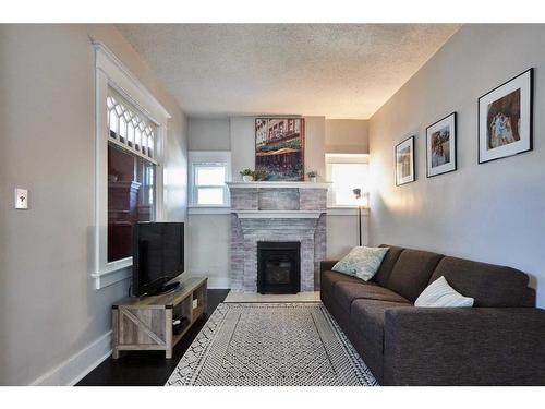 384 10 Street Se, Medicine Hat, AB - Indoor Photo Showing Living Room With Fireplace