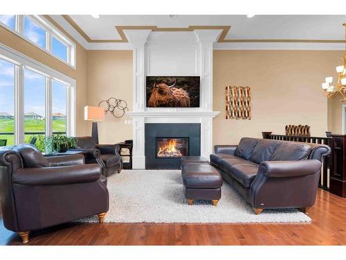 284 Desert Blume Drive, Desert Blume, AB - Indoor Photo Showing Living Room With Fireplace