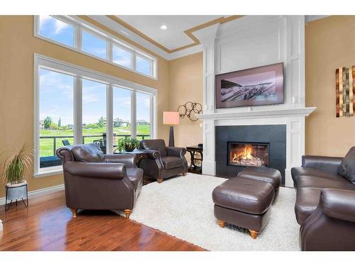 284 Desert Blume Drive, Desert Blume, AB - Indoor Photo Showing Living Room With Fireplace