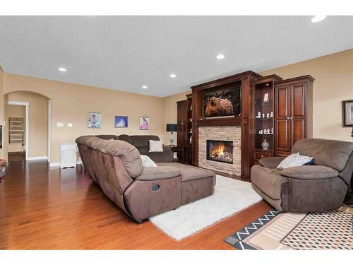 284 Desert Blume Drive, Desert Blume, AB - Indoor Photo Showing Living Room With Fireplace