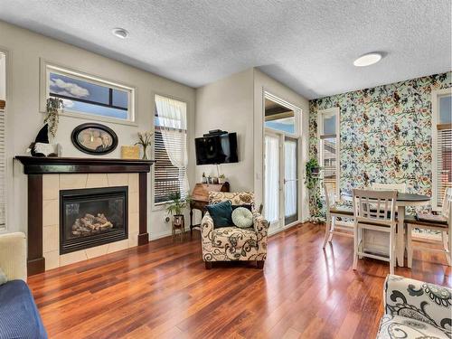 15 Somerset Place Se, Medicine Hat, AB - Indoor Photo Showing Living Room With Fireplace