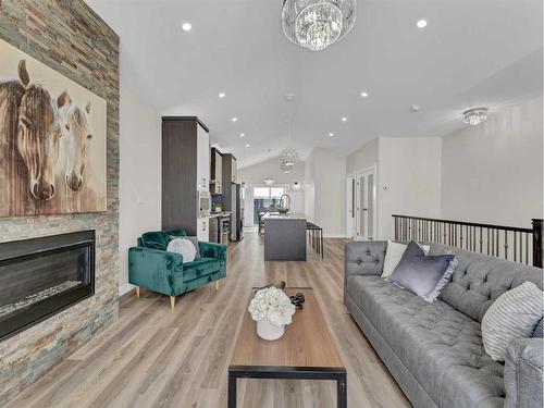 33 Dunes Way, Desert Blume, AB - Indoor Photo Showing Living Room With Fireplace