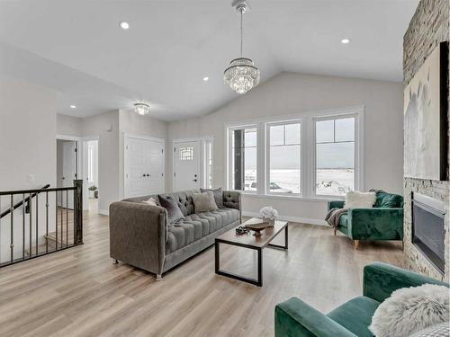 33 Dunes Way, Desert Blume, AB - Indoor Photo Showing Living Room With Fireplace