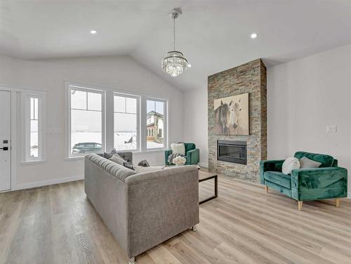 33 Dunes Way, Desert Blume, AB - Indoor Photo Showing Living Room With Fireplace