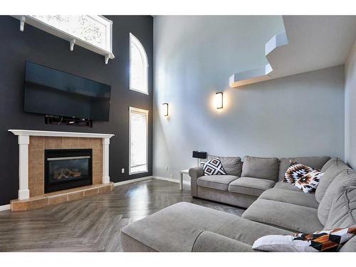 23 Sunrise Court Sw, Medicine Hat, AB - Indoor Photo Showing Living Room With Fireplace