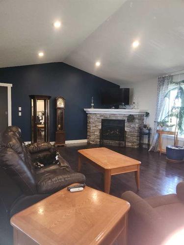 29305 Range Road 41, Oyen, AB - Indoor Photo Showing Living Room With Fireplace