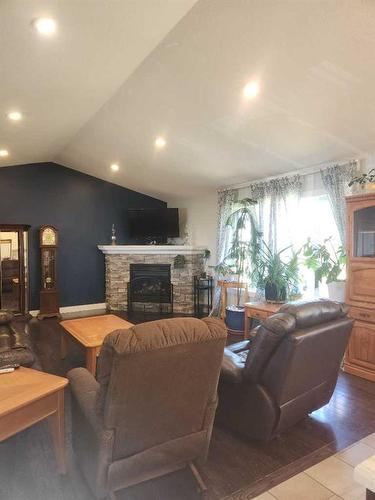 29305 Range Road 41, Oyen, AB - Indoor Photo Showing Living Room With Fireplace