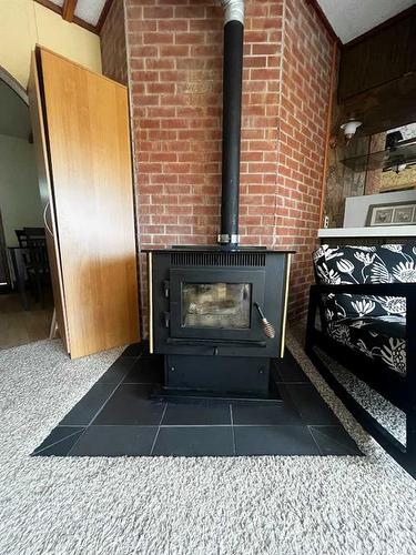 14 5 Avenue, Rural Cypress County, AB - Indoor Photo Showing Other Room With Fireplace