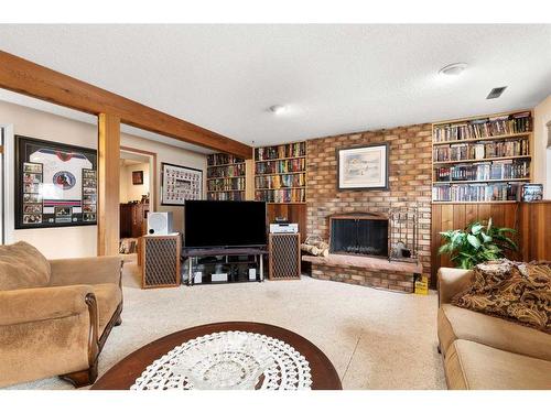 24 Sunflower Court Se, Medicine Hat, AB - Indoor Photo Showing Living Room With Fireplace