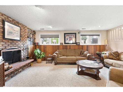 24 Sunflower Court Se, Medicine Hat, AB - Indoor Photo Showing Living Room With Fireplace