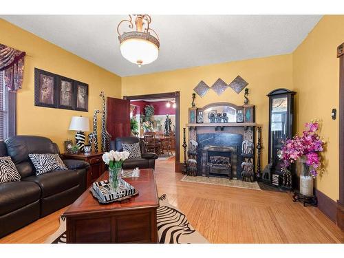 271 1 Street Se, Medicine Hat, AB - Indoor Photo Showing Living Room With Fireplace