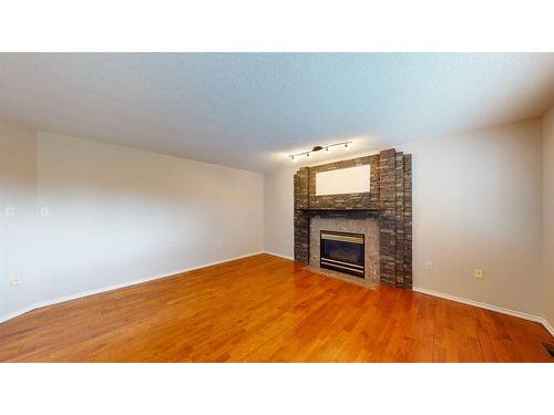 35 Park Meadows Place Se, Medicine Hat, AB - Indoor Photo Showing Other Room With Fireplace