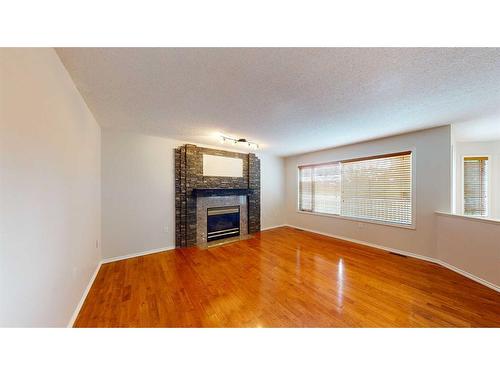 35 Park Meadows Place Se, Medicine Hat, AB - Indoor Photo Showing Living Room With Fireplace