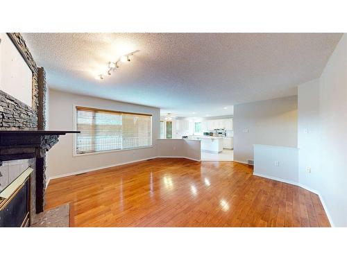 35 Park Meadows Place Se, Medicine Hat, AB - Indoor Photo Showing Other Room With Fireplace