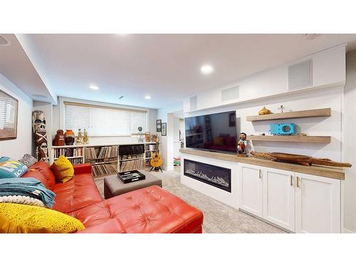 145 1 Street Sw, Medicine Hat, AB - Indoor Photo Showing Living Room With Fireplace