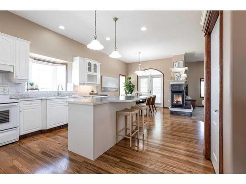 2 Vintage Meadows Court Se, Medicine Hat, AB - Indoor Photo Showing Kitchen With Fireplace With Upgraded Kitchen