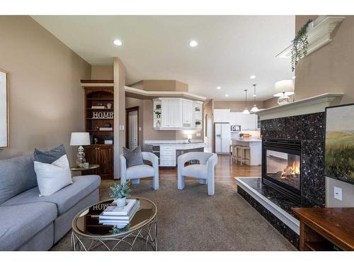 2 Vintage Meadows Court Se, Medicine Hat, AB - Indoor Photo Showing Living Room With Fireplace