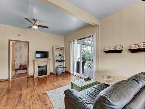 8 2 Avenue West, Empress, AB - Indoor Photo Showing Living Room With Fireplace