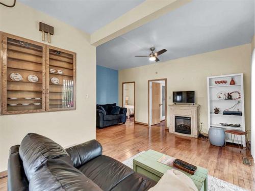 8 2 Avenue West, Empress, AB - Indoor Photo Showing Living Room With Fireplace