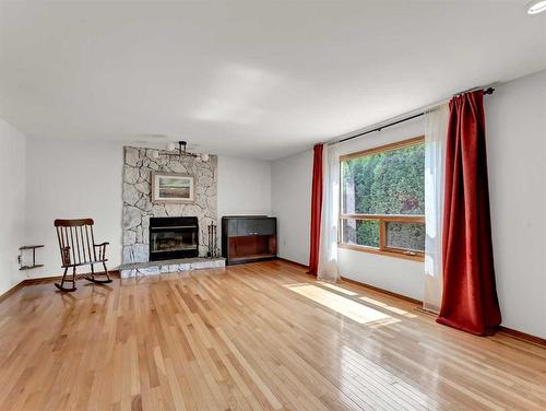 45 Shaw Crescent, Medicine Hat, AB - Indoor Photo Showing Living Room With Fireplace