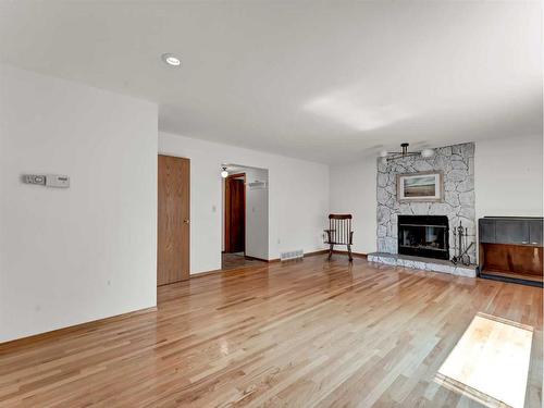 45 Shaw Crescent, Medicine Hat, AB - Indoor Photo Showing Living Room With Fireplace