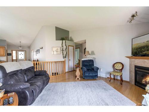 16 Sandstone Place Se, Medicine Hat, AB - Indoor Photo Showing Living Room With Fireplace