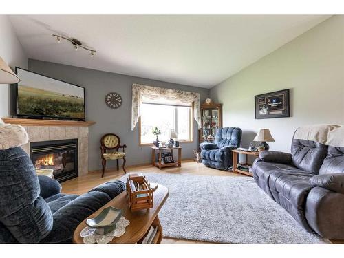 16 Sandstone Place Se, Medicine Hat, AB - Indoor Photo Showing Living Room With Fireplace