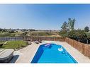 252 Seven Persons Drive Sw, Medicine Hat, AB  - Outdoor With In Ground Pool With Backyard 