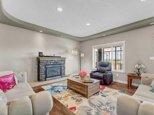 3 Desert Blume Gate, Desert Blume, AB - Indoor Photo Showing Living Room With Fireplace