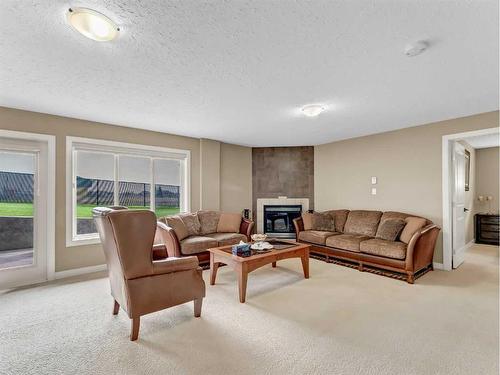 3 Desert Blume Gate, Desert Blume, AB - Indoor Photo Showing Living Room With Fireplace