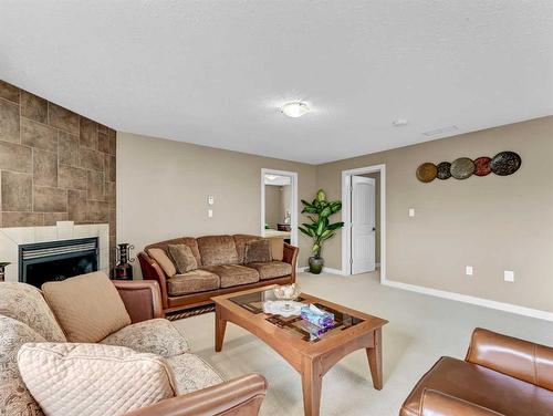 3 Desert Blume Gate, Desert Blume, AB - Indoor Photo Showing Living Room With Fireplace