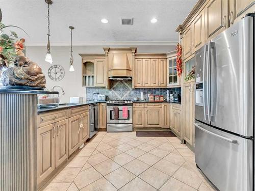 3 Desert Blume Gate, Desert Blume, AB - Indoor Photo Showing Kitchen With Stainless Steel Kitchen