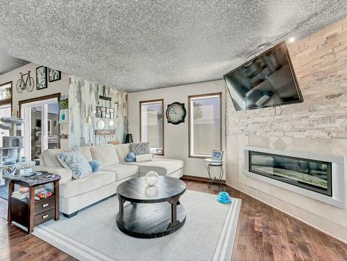 2-13027 Range Road 50, Rural Cypress County, AB - Indoor Photo Showing Living Room With Fireplace