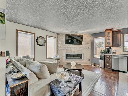 2-13027 Range Road 50, Rural Cypress County, AB - Indoor Photo Showing Living Room With Fireplace