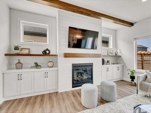 195 Hamptons Crescent Se, Medicine Hat, AB - Indoor Photo Showing Living Room With Fireplace