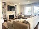 938 Manor Place, Redcliff, AB  - Indoor Photo Showing Living Room With Fireplace 