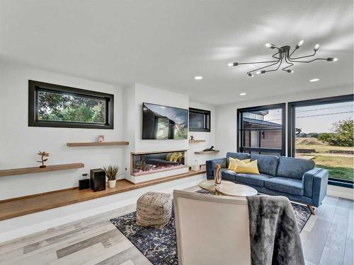 227 12 Street Se, Medicine Hat, AB - Indoor Photo Showing Living Room With Fireplace