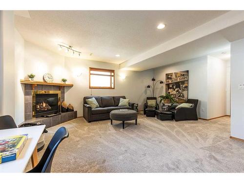 67 Vintage Meadows Place Se, Medicine Hat, AB - Indoor Photo Showing Living Room With Fireplace